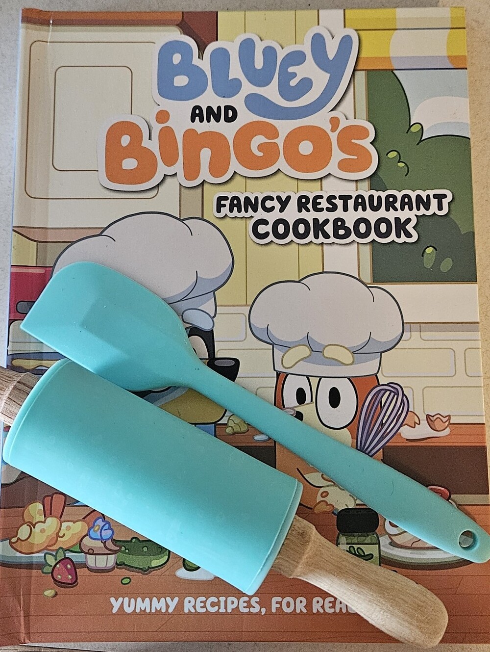 Bluey and Bingo's Fancy Restaurant Cookbook with Teal Silicone Kitchen Tools